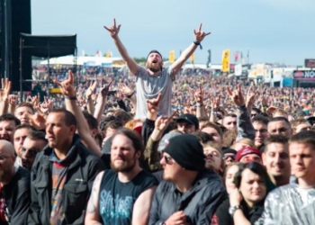 CASTLE DONINGTON, ENGLAND - JUNE 15:  Festival goers cheering in the crowd during day 2 of Download Festival 2019 at Donington Park on June 14, 2019 in Castle Donington, England.  (Photo by Joseph Okpako/WireImage)